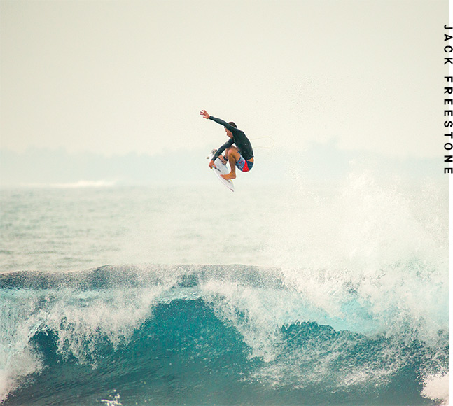 Jack Freestone wearing Billabong Tribong X Fronds Boardshorts in Neo Red